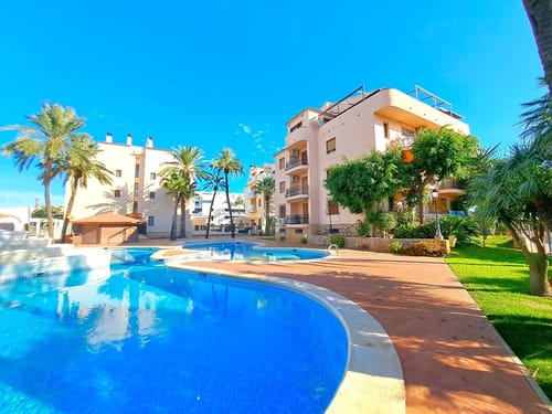 Penthouse with a large terrace and pool for sale in Dénia beach.